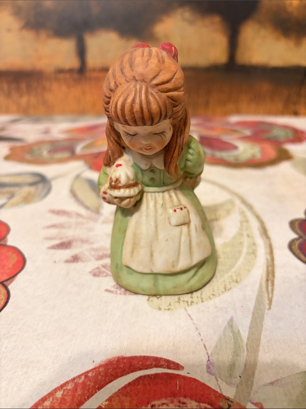 Hand-Painted Porcelain Girl Figurine in Green and Cream